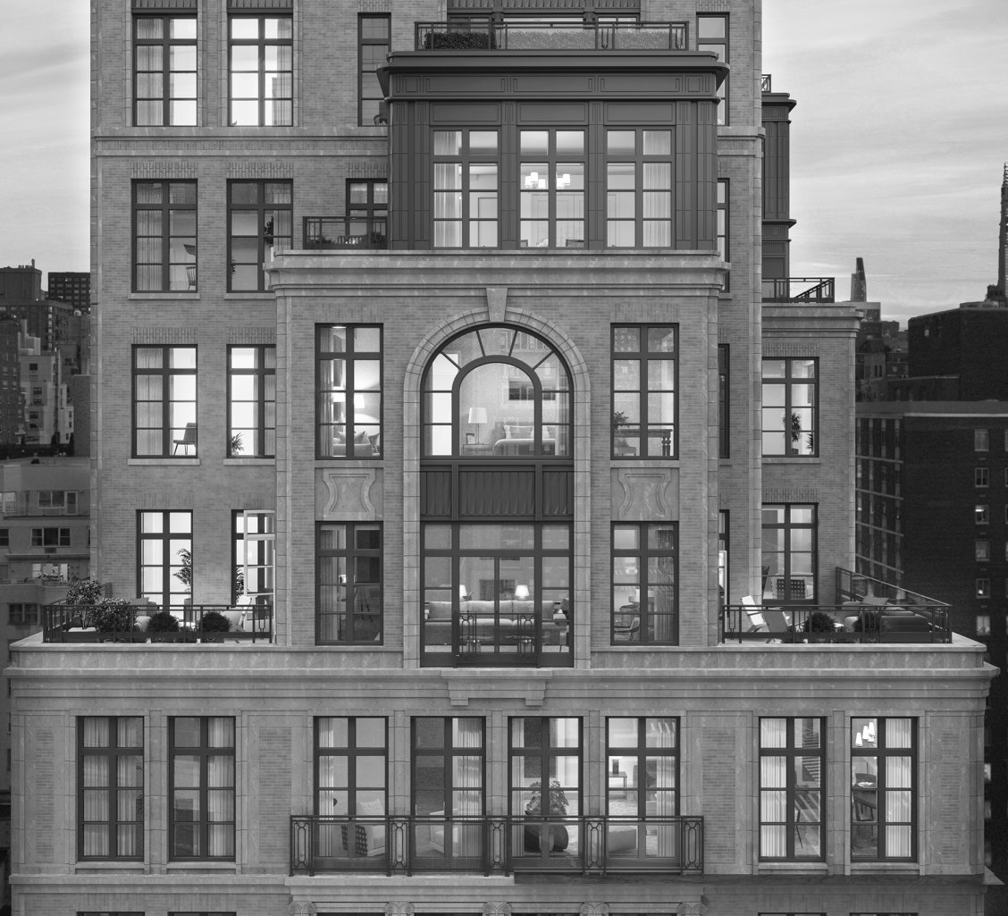A black and white closeup of half way up the front of the building